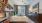a bedroom with a bed and a desk