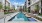 a pool in a courtyard between buildings