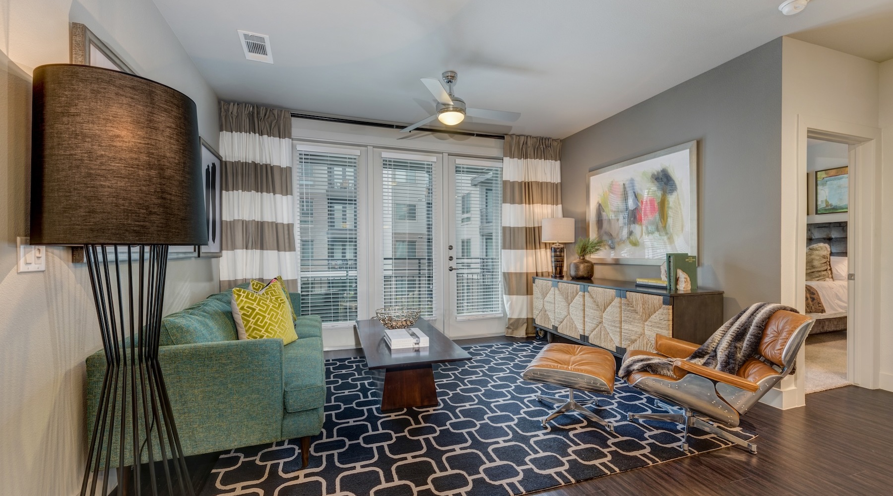 living room with a large window and open spaces