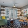 living room with a large window and open spaces