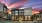 a multistory building with a sunset in the background